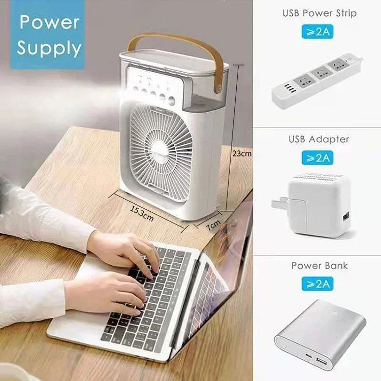 Mini air conditioner portable humidifier next to a laptop, illustrating power supply options like USB adapter and power bank.